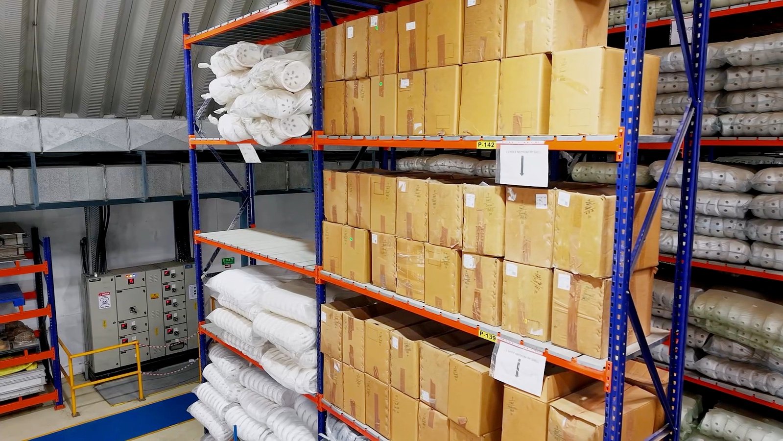 Tall storage racks inside the Premier factory
