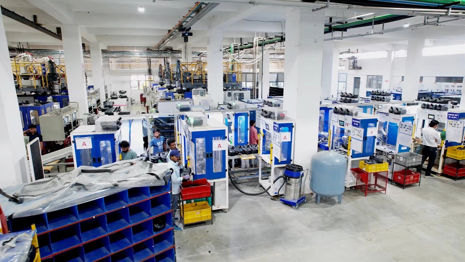 Busy Premier production floor with teams and machines at work