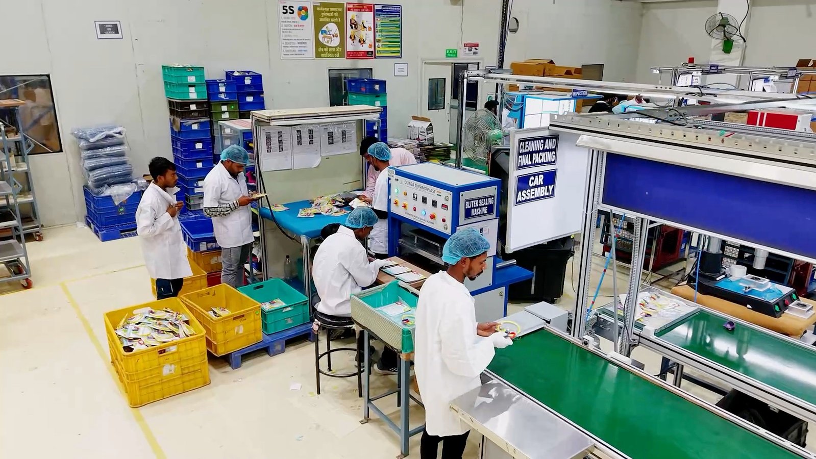 Premier production team working on an assembly and inspection line
